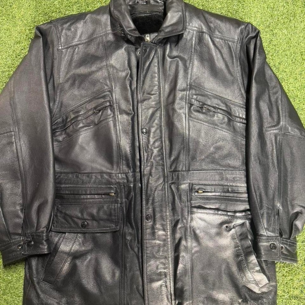Black leather jacket with multiple‎ pockets and zippers. Size: M #biker